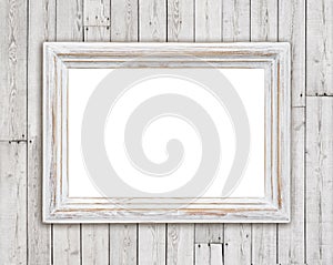 Bleached wooden picture frame on vintage plank wall background photo