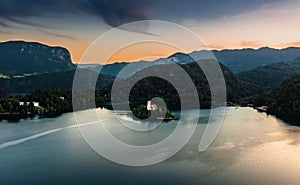 Bled, Slovenia - Aerial view of Pilgrimage Church of the Assumption of Maria at Lake Bled with Julian Alps at backgroud photo