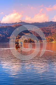 Bled, Slovenia boat and church at sunset