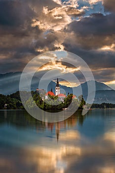 Bled, Slovenia - Golden sunrise at Lake Bled Blejsko Jezero with the Pilgrimage Church of the Assumption of Maria on an island photo