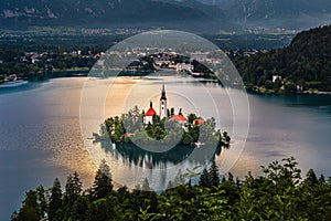 Bled, Slovenia - Pilgrimage Church of the Assumption of Maria on an island at Lake Bled Blejsko Jezero and Julian Alps photo