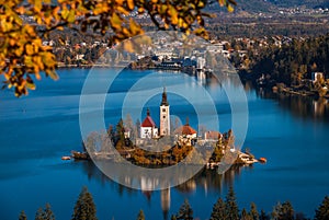 Bled, Slovenia - Sunrise at lake Bled taken from Osojnica viewpoint with traditional Pletna boat and Bled Castle at background