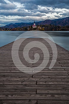 Bled, Slovenia - Sunset at the beautiful Lake Bled with Pilgrimage Church of the Assumption of Maria and pier