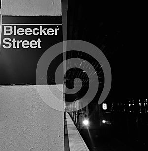 Bleecker Street NYC Subway MTA Train Arriving Station Platform Black and White New York City