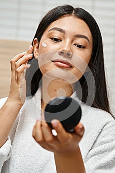 blemish treatment cream on face of photo