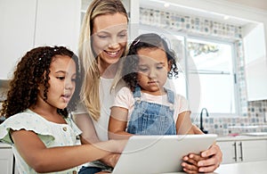 Blended family, adoption and a mother with her kids on a tablet in the kitchen for education or learning. Sister