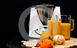 Blender or mixer with oranges