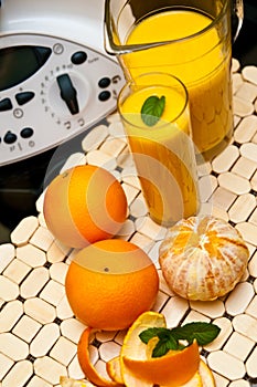 Blender or mixer with oranges
