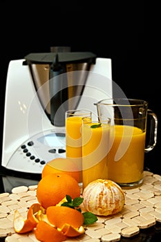 Blender or mixer with oranges