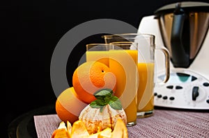 Blender or mixer with oranges