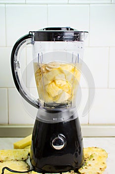 Blender ready for making pineapple banana smoothie