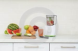 Blender and smoothie ingredients in kitchen