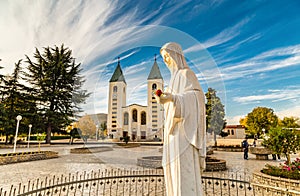 Blessed Virgin Mary with red rose