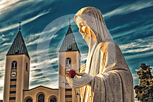 Blessed Virgin Mary with red rose
