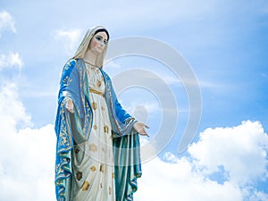 The Blessed Virgin Mary Statue blue sky background