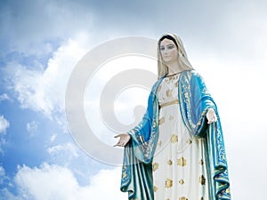 The Blessed Virgin Mary Statue blue sky background