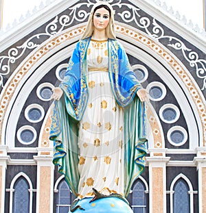 Blessed Virgin Mary statue and Christian church