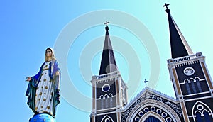Blessed Virgin Mary statue and Christian church
