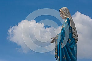 The Blessed Virgin Mary statue standing in front of The Cathedral of the Immaculate Conception at The Roman Catholic Diocese.