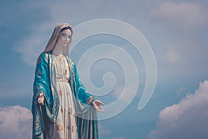 The Blessed Virgin Mary statue standing in front of The Cathedral of the Immaculate Conception at The Roman Catholic Diocese.