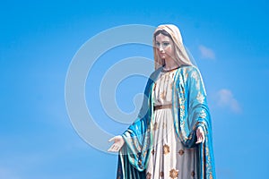 The Blessed Virgin Mary statue standing in front of the Roman Catholic Diocese with blue sky background at Chanthaburi Province.