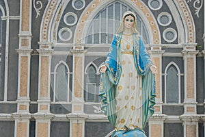 The Blessed Virgin Mary statue standing in front of The Roman Catholic Diocese.