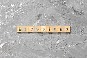 Blessings word written on wood block. Blessings text on cement table for your desing, Top view concept