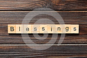 Blessings word written on wood block. Blessings text on wooden table for your desing, Top view concept