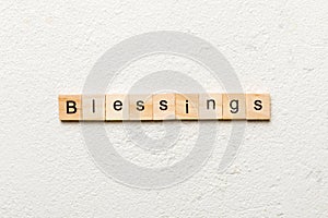 Blessings word written on wood block. Blessings text on cement table for your desing, Top view concept