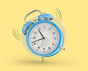 Bleu alarm clock is ringing over yellow background