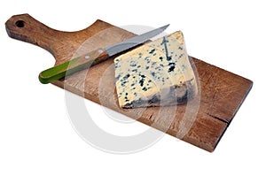 Bleu des Causses on a cutting board with a knife on white background
