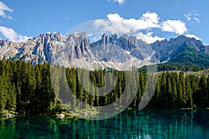 a bleu lake in the dolomites Italy, Carezza lake Lago di Carezza, Karersee with Mount Latemar