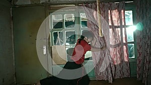 Blind Asian Woman dancing with the red curtain as a property in anger