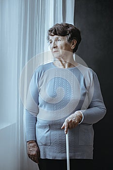 Blind lonely woman with cane