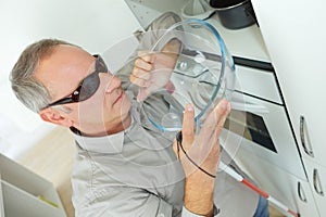 Blind man in kitchen