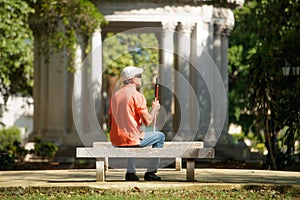 Blind Man Sitting In City Park And Resting