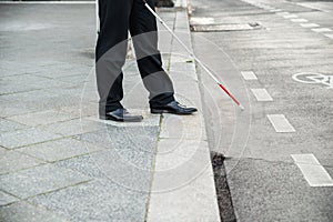 Blind person crossing street photo
