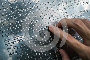 Blind person reading braille text