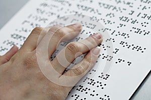 Blind reading, fingers and symbols closeup