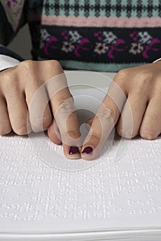 Blind reading text in braille language