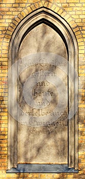 Blind window of the burial chapel in Guetzkow, Mecklenburg-Vorpommern, Germany with bible passage - Hebrews 13:8