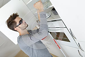 Blind young boy in kitchen