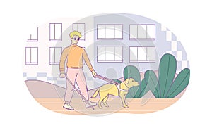 Blind young man walking with his dog along street