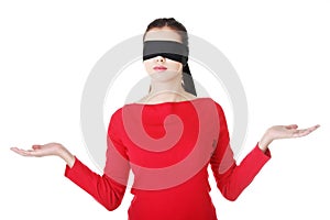 Blindfold woman presenting copy space