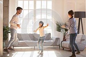 Blindfolded girl catching parents playing hide and seek game