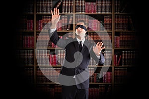 Blindfolded Lawyer Gesturing In Office