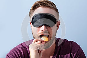 Blindfolded Man Testing Food