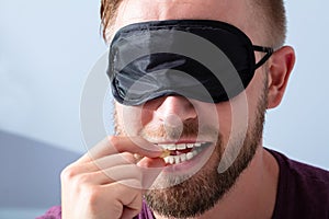 Blindfolded Man Testing Food