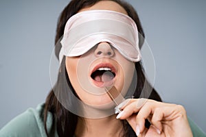 Blindfolded Young Woman Testing Food