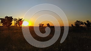 Blinding sunset in the fields photo